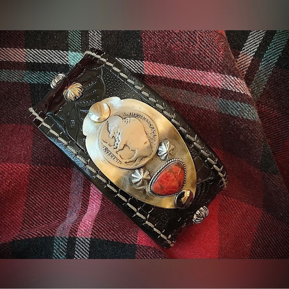 Boho Black leather cuff featuring 1930's Buffalo
nickel coral cabochon